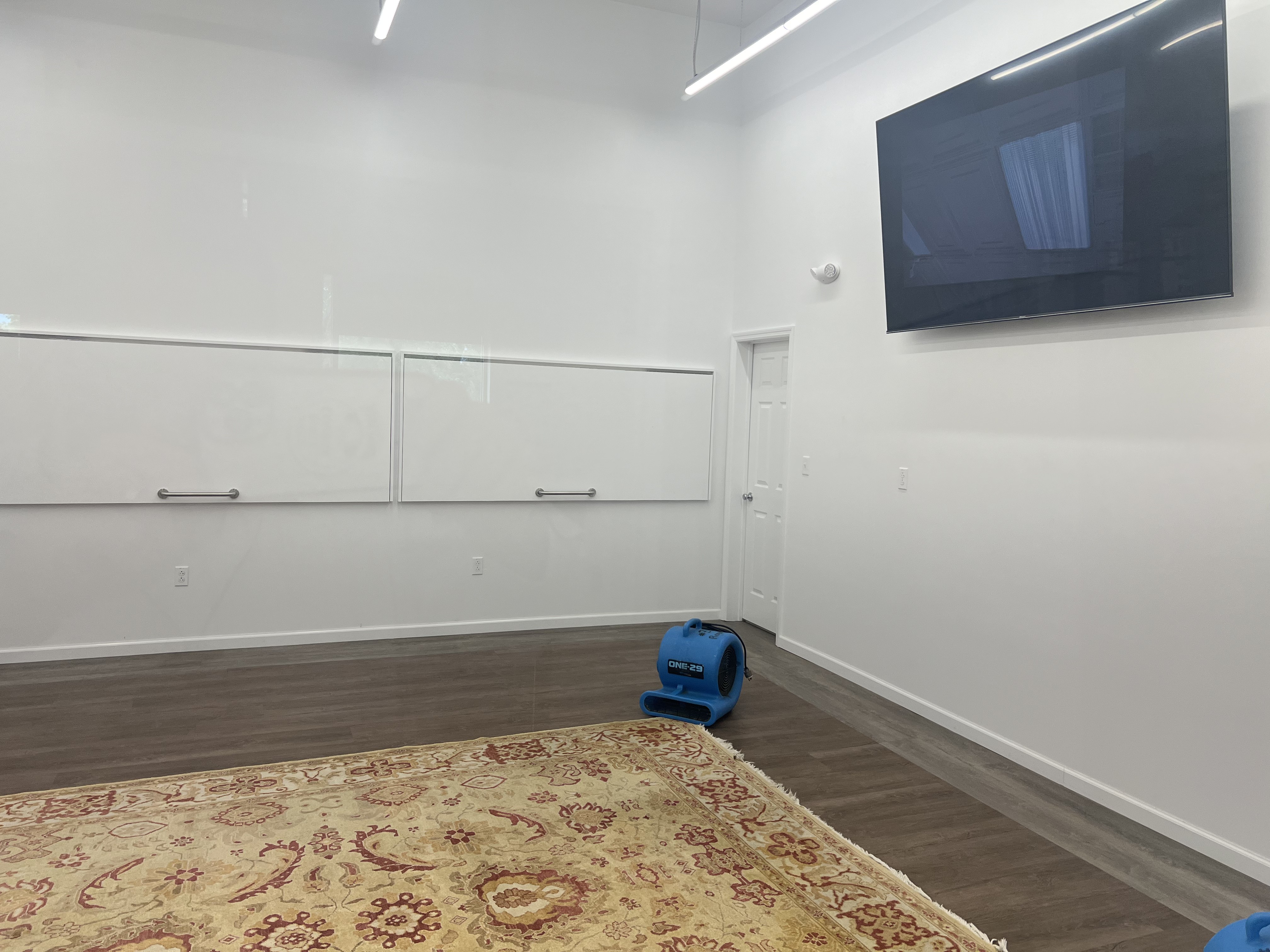 Air movers drying a room during water damage restoration by Royalty Carpet in the Hudson Valley